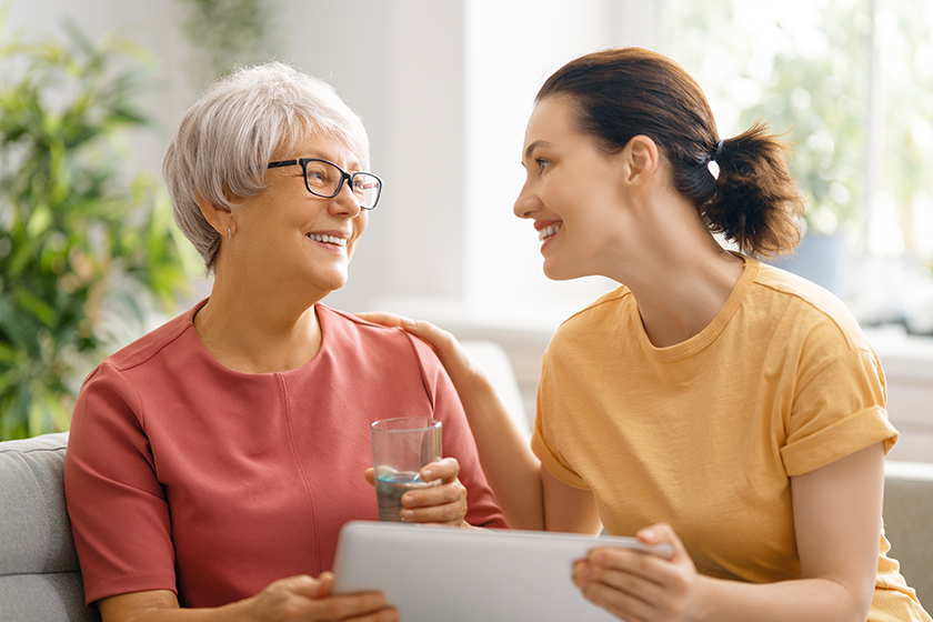 Young and senior women are using laptop pc